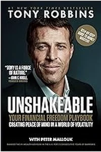 Book cover of Unshakeable by Tony Robbins, black background with the author’s photo at the top.