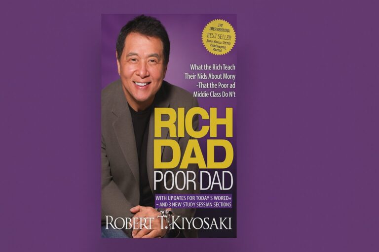 Book cover of Rich Dad Poor Dad by Robert Kiyosaki on a desk with notebook and calculator — symbolizing financial literacy and cashflow mindset.